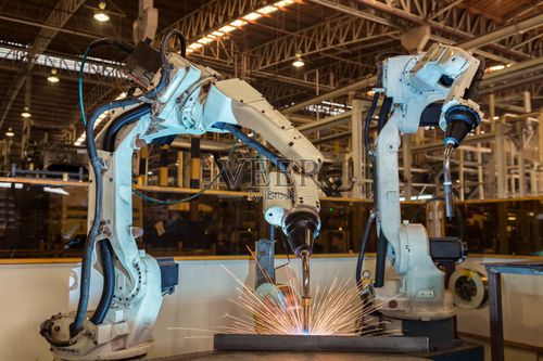 团队机器人在工厂焊接汽车零件图片素材下载 - veer图库
